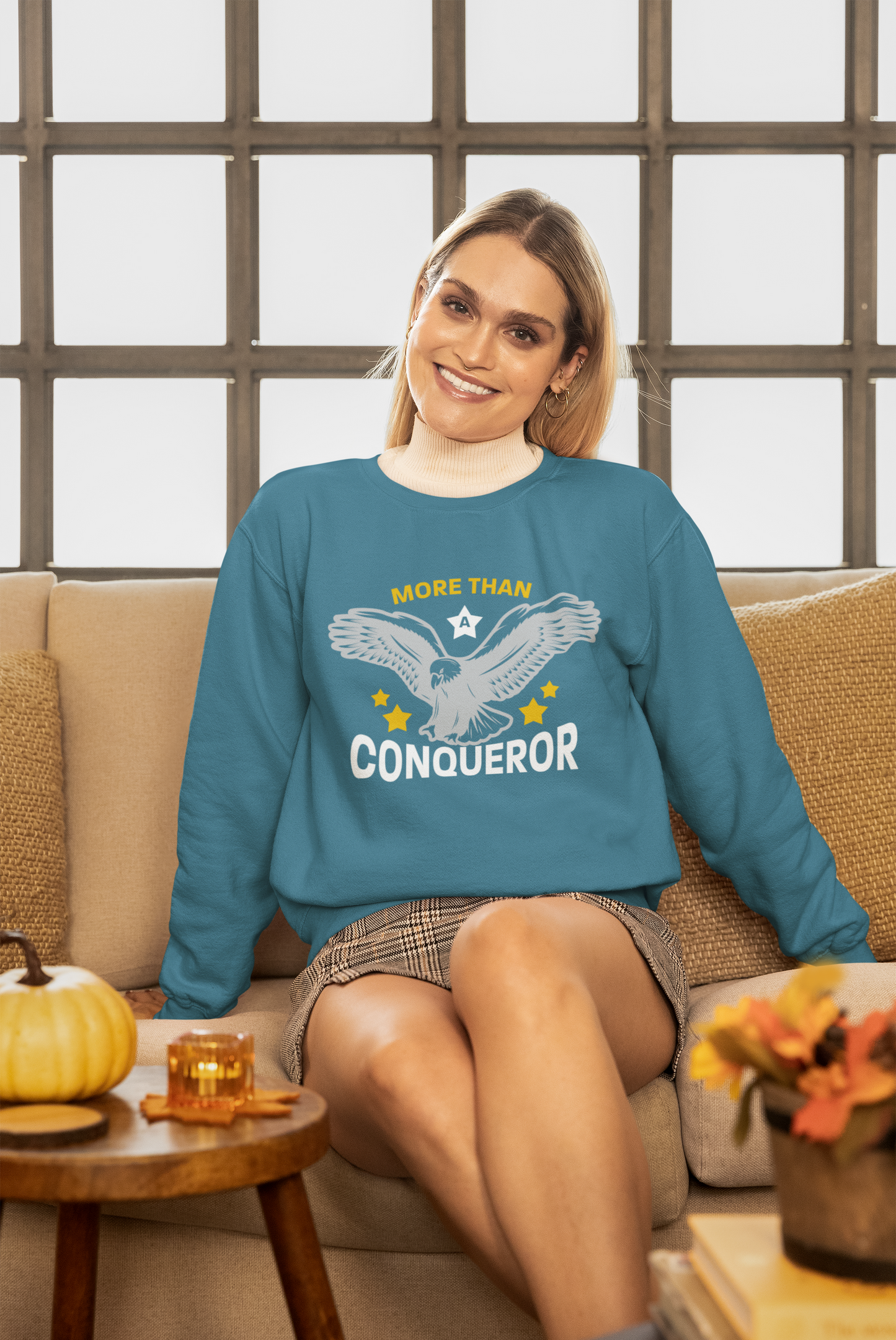 More Than a Conqueror Unisex Sweatshirt with Signature Logo